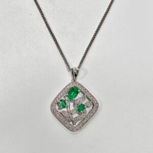 18ct white gold emerald and diamond square flower design pendant on a spiga chain